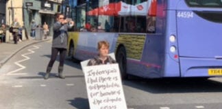 “I will not be a bystander’: Two years on from Parliament’s declaration of climate emergency local woman takes action in Swansea with 100s of others around the UK