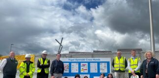 Carmarthenshire school competition winners see posters installed on building site