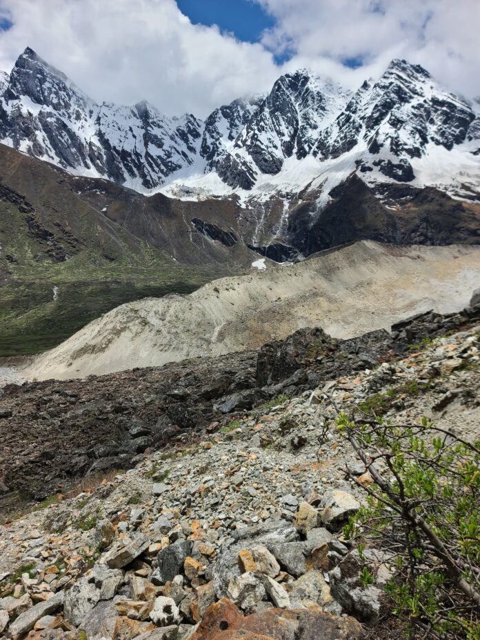 E Glacier cavern of Kangdoshung glacier. The stream from Kangshang glacier passes underneath 2