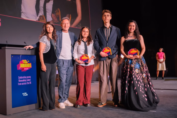 Araminta-accepting-award-with-other-recipients